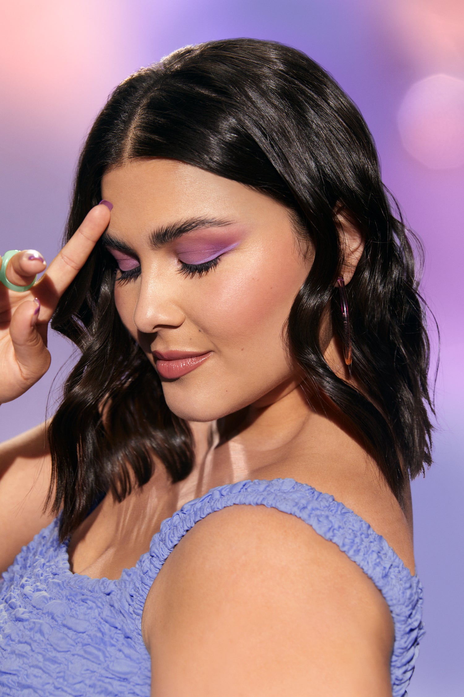 woman with her brows and lashes done looking down with her eyes closed