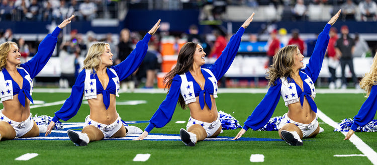 The Dallas Cowboys Cheerleaders performing at a game.