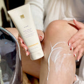 Person applying Coconut Body Polish to their leg.