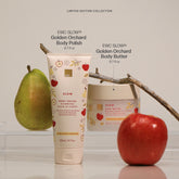 A skincare duo from EWC Fragrance featuring a tube of Golden Orchard Body Polish and Body Butter set against a cream background with fresh fruit props.