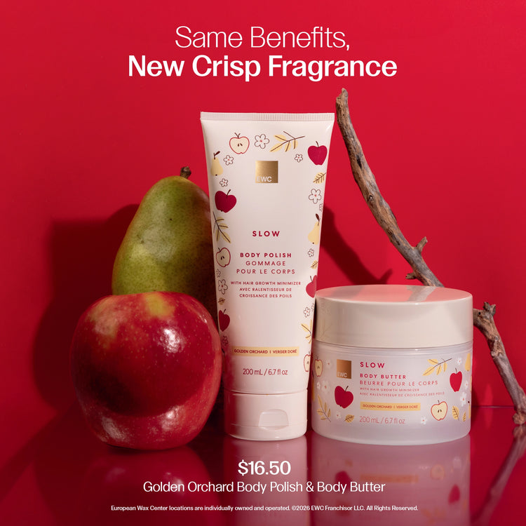 A skincare duo from EWC Fragrance featuring a tube of Golden Orchard Body Polish and Body Butter set against a vibrant red background with fresh fruit props.