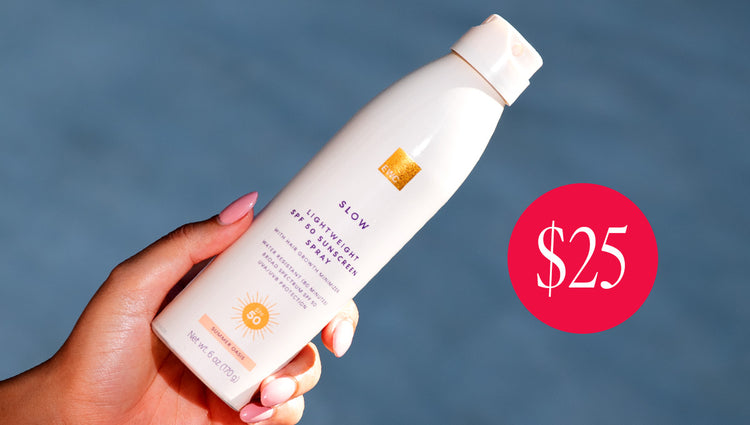 Hand holding a bottle of the new EWC SPF 50 sunscreen with a blue background, $25.