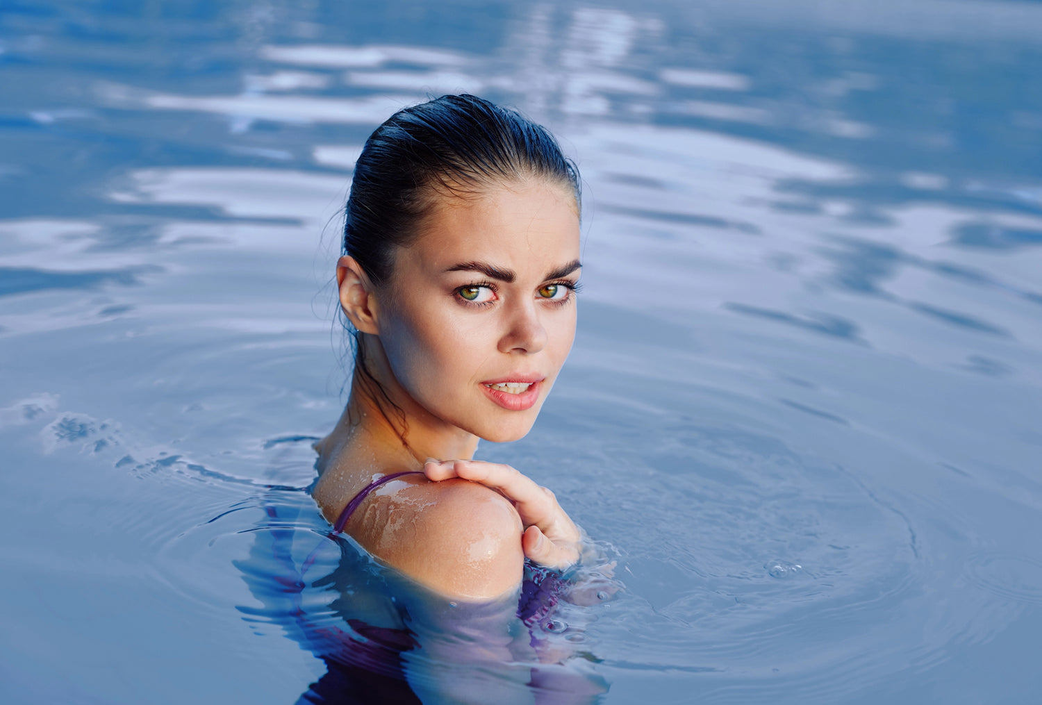 Woman in pool with wet hair