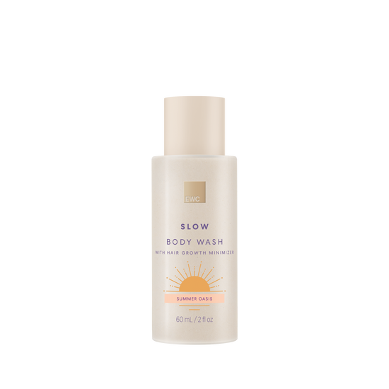 Body wash bottle labeled 'Slow' with 'Summer Oasis' scent on a white background
